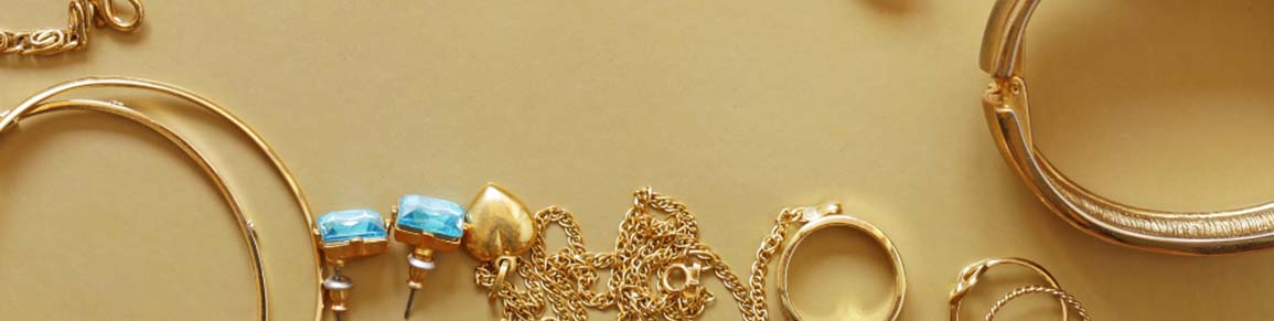 gold jewelry on gold background
